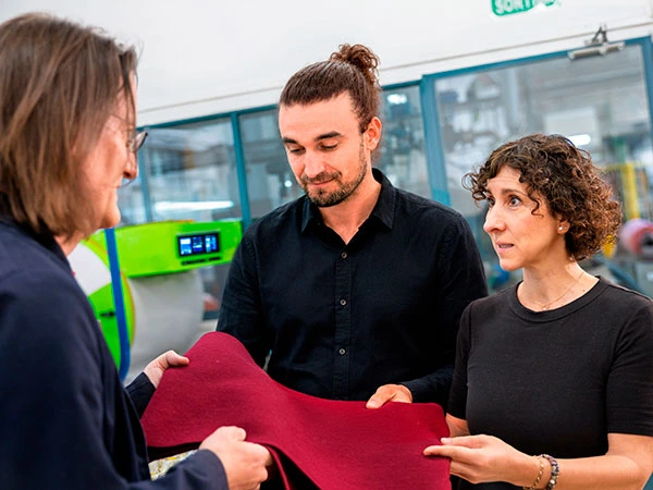 Sakudarte during a meeting with a textile client